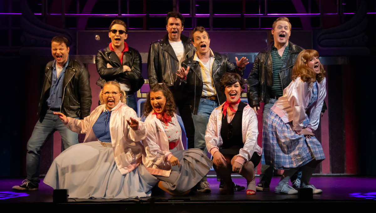 Andrew Hally with the cast of Grease